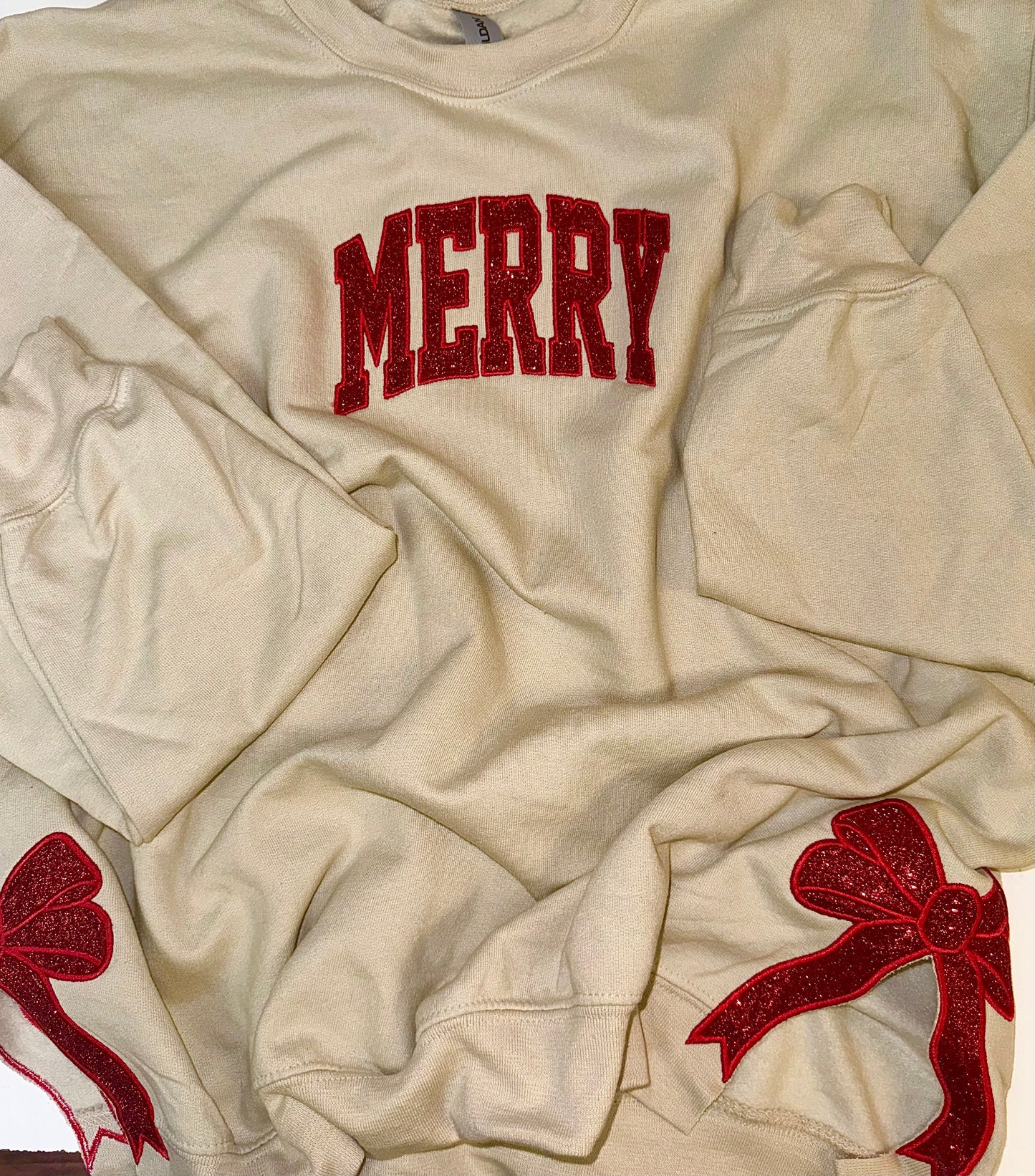 Embroidered glitter MERRY w/ added glitter side bows sweater top