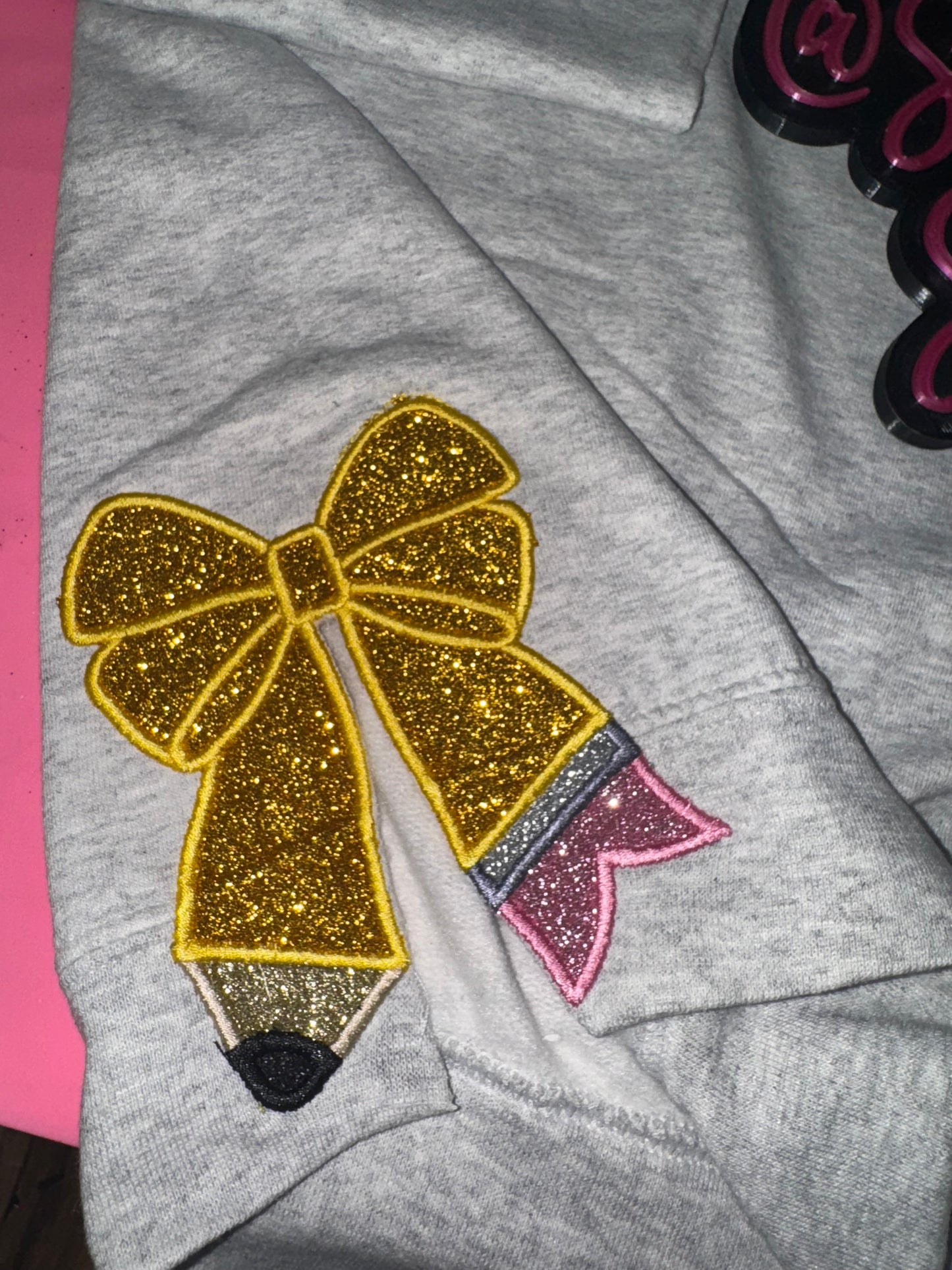 Embroidered teach side pencil sweater top