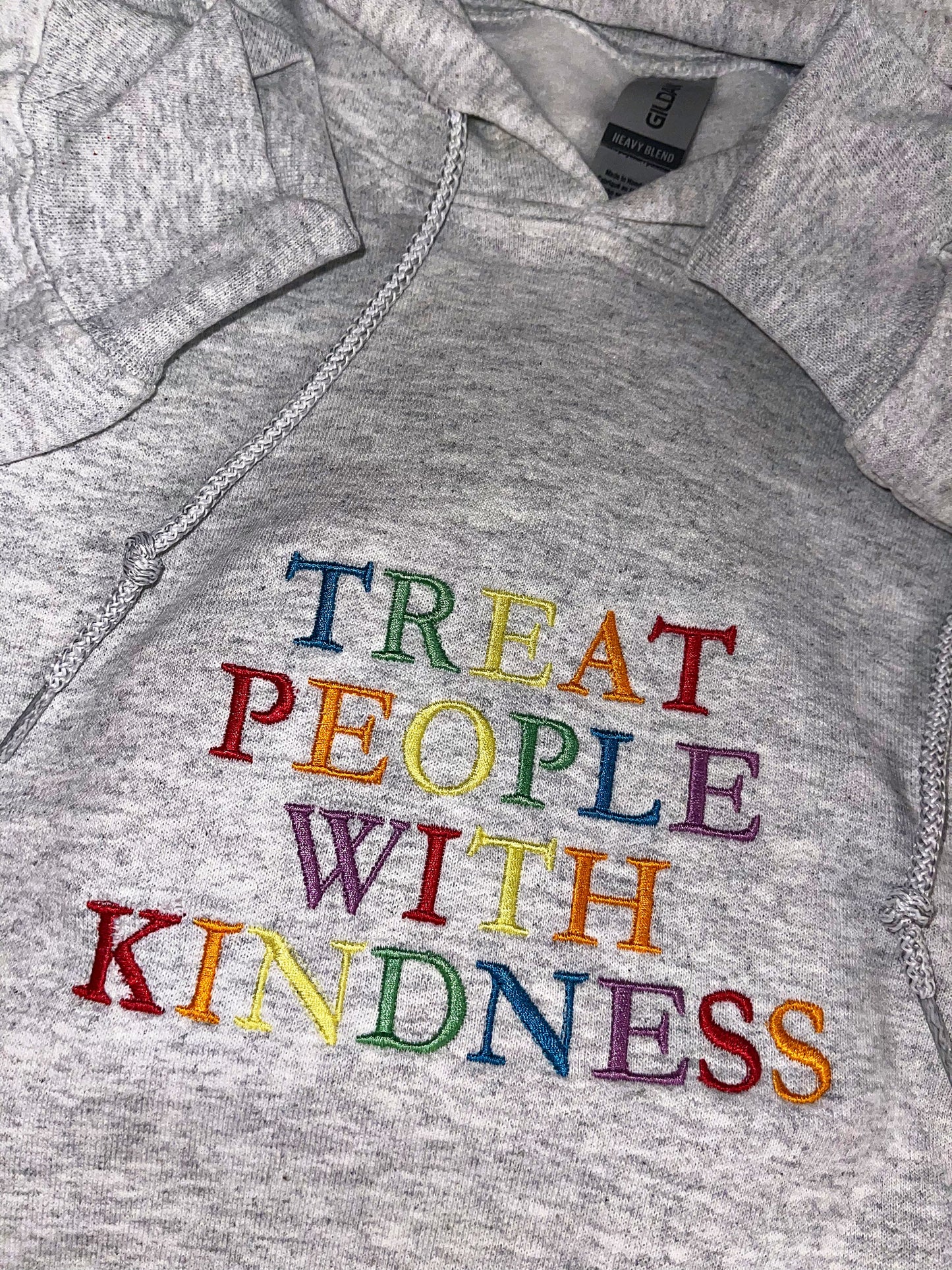 Treat people with kindness embroidered top