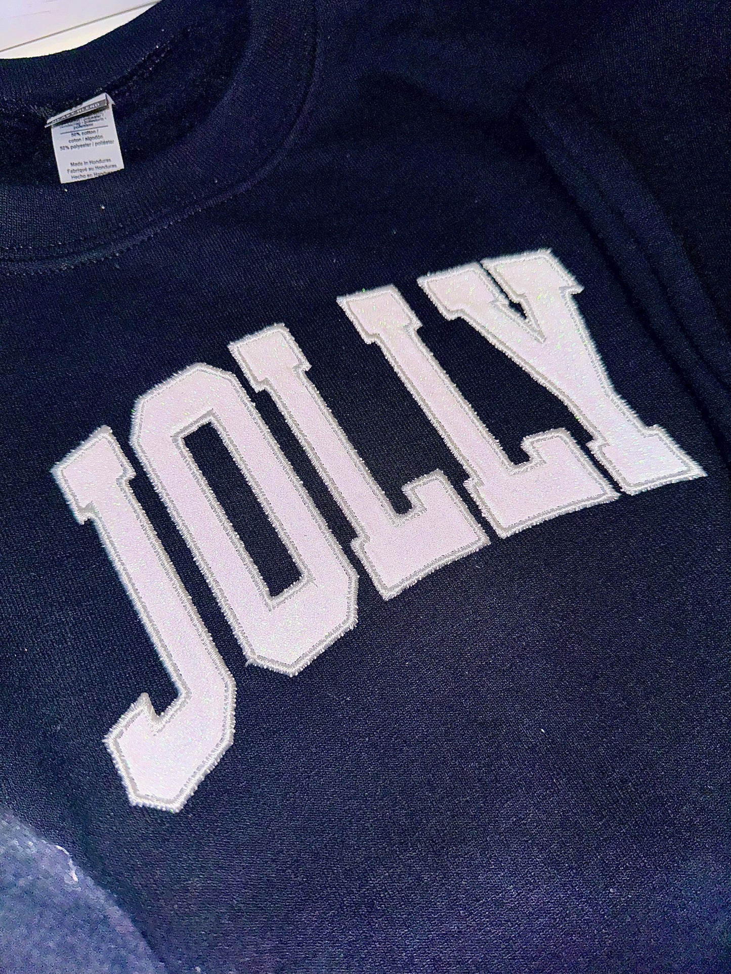 Embroidered glitter JOLLY w/ plaid side bows sweater top