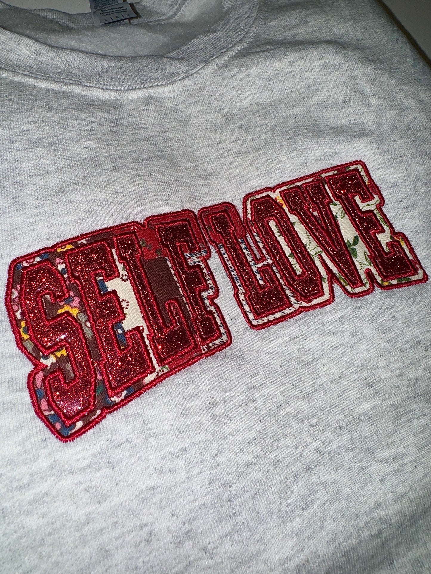 SELF LOVE glitter/fabric embroidered sweater