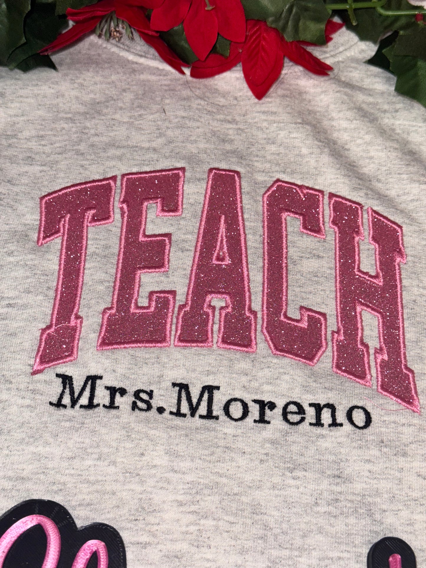 Embroidered teach side pencil sweater top