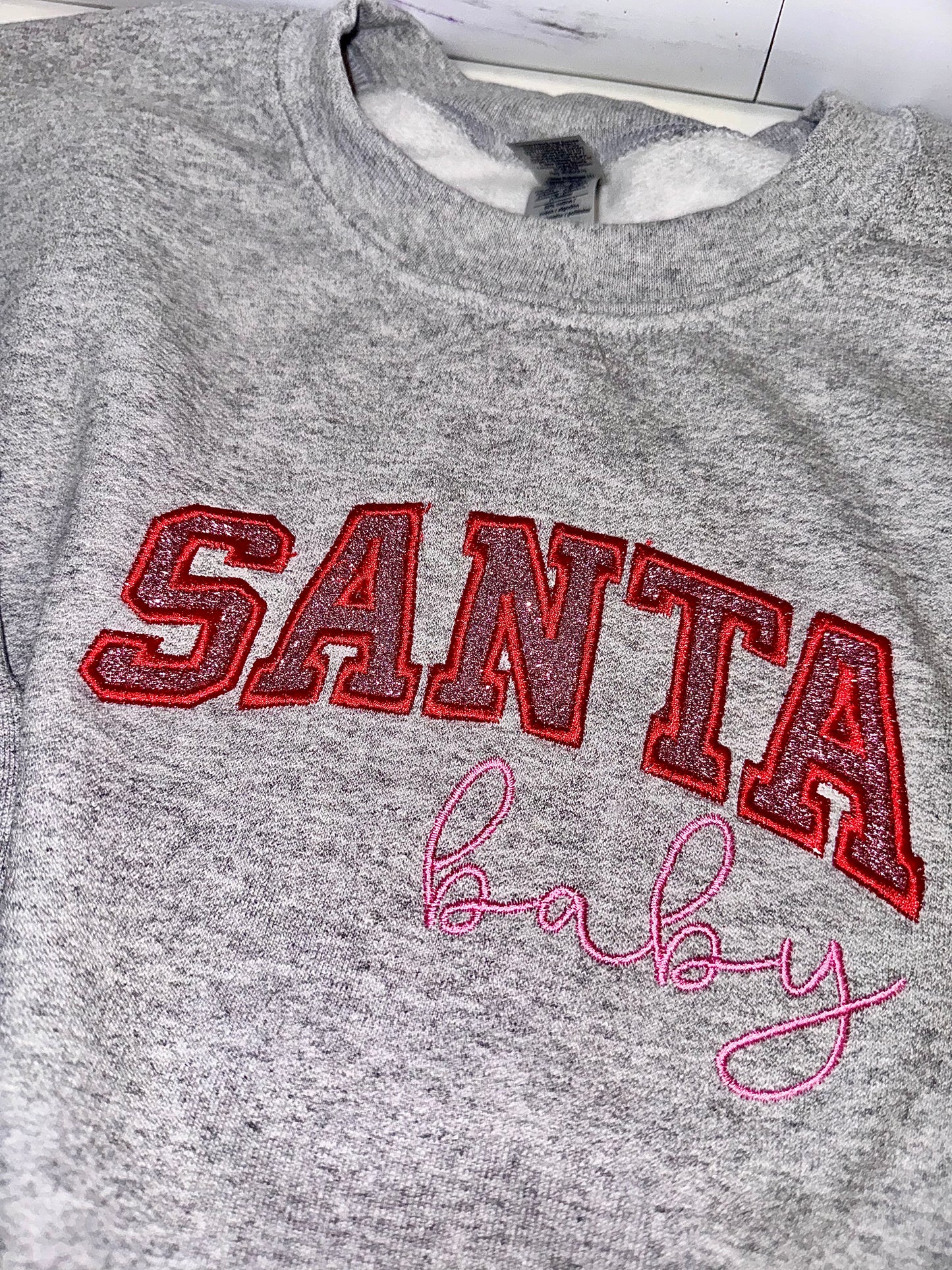 Embroidered glitter Santa Baby w/ added glitter side bows sweater top