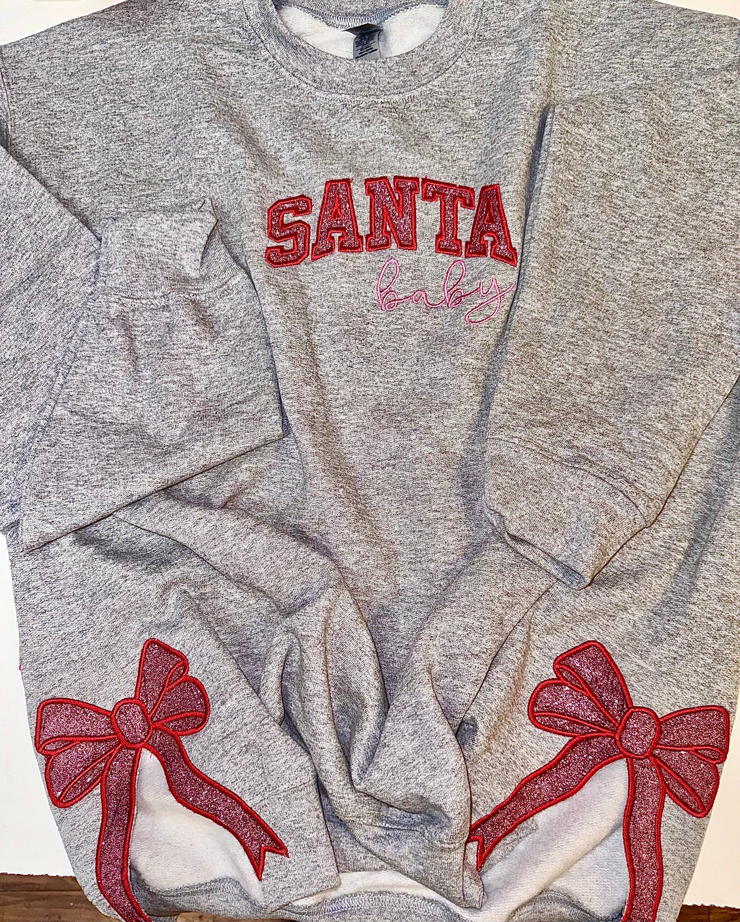 Embroidered glitter Santa Baby w/ added glitter side bows sweater top