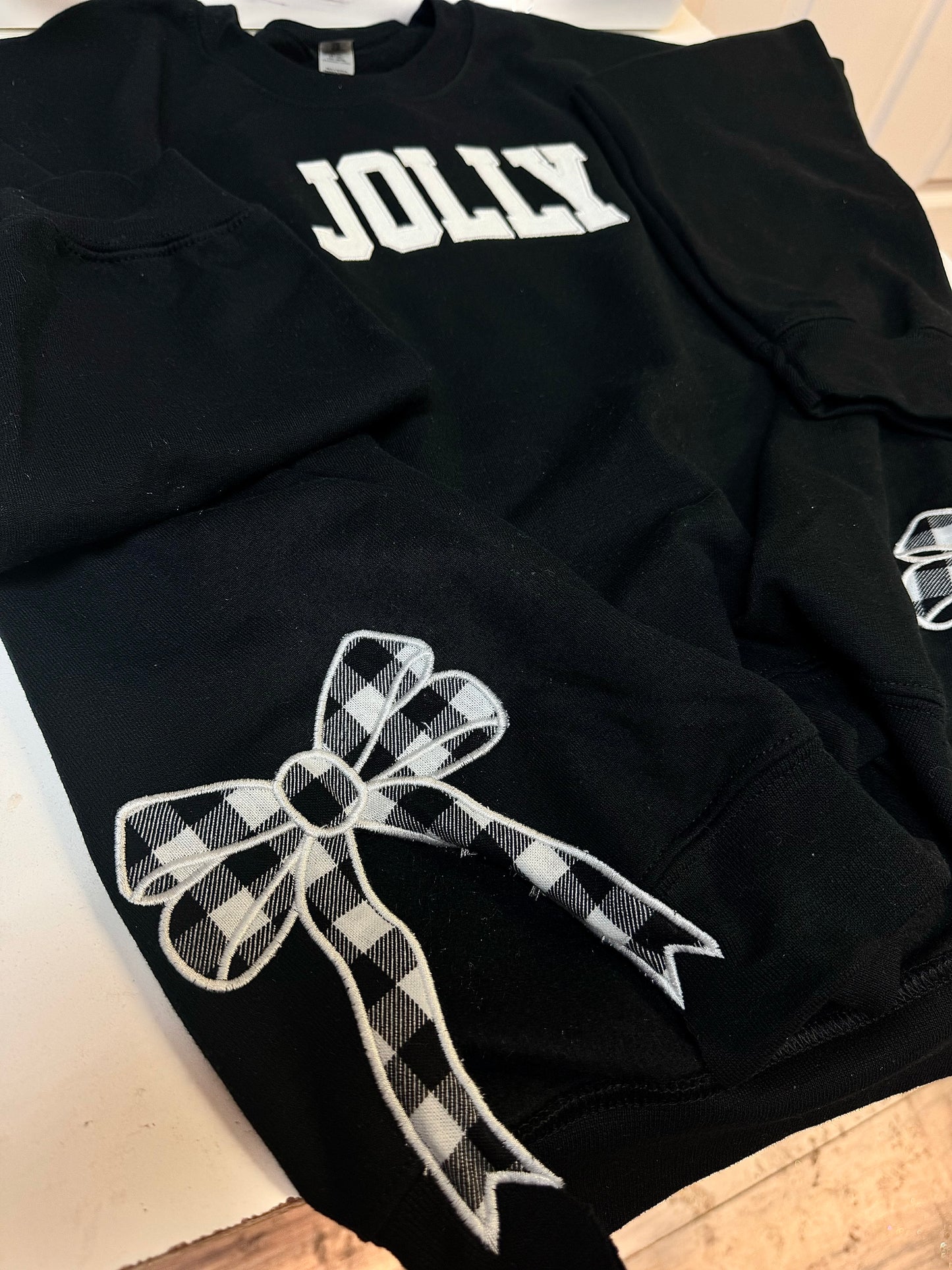 Embroidered glitter JOLLY w/ plaid side bows sweater top