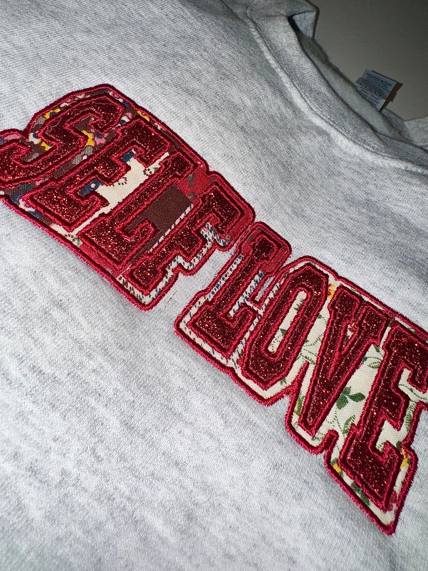SELF LOVE glitter/fabric embroidered sweater