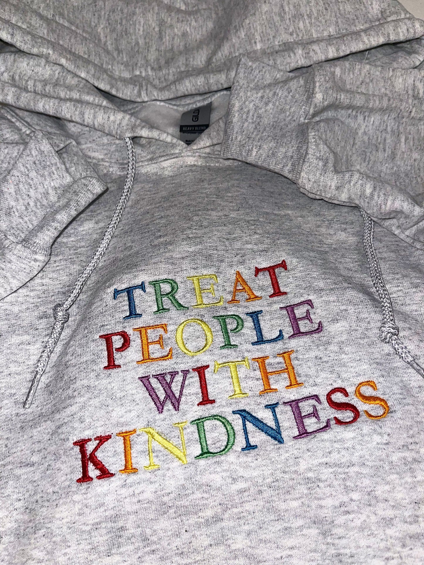 Treat people with kindness embroidered top