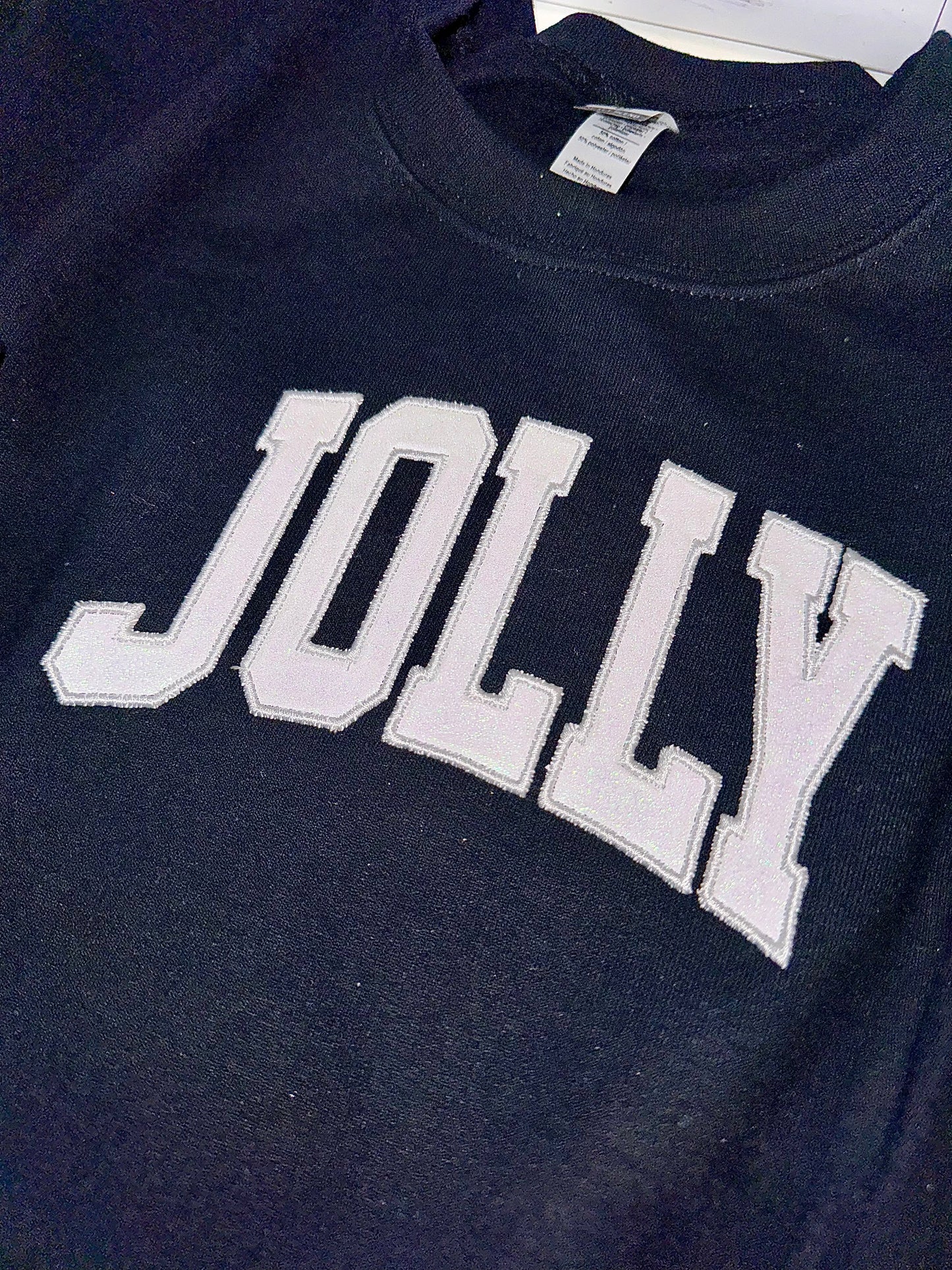 Embroidered glitter JOLLY w/ plaid side bows sweater top