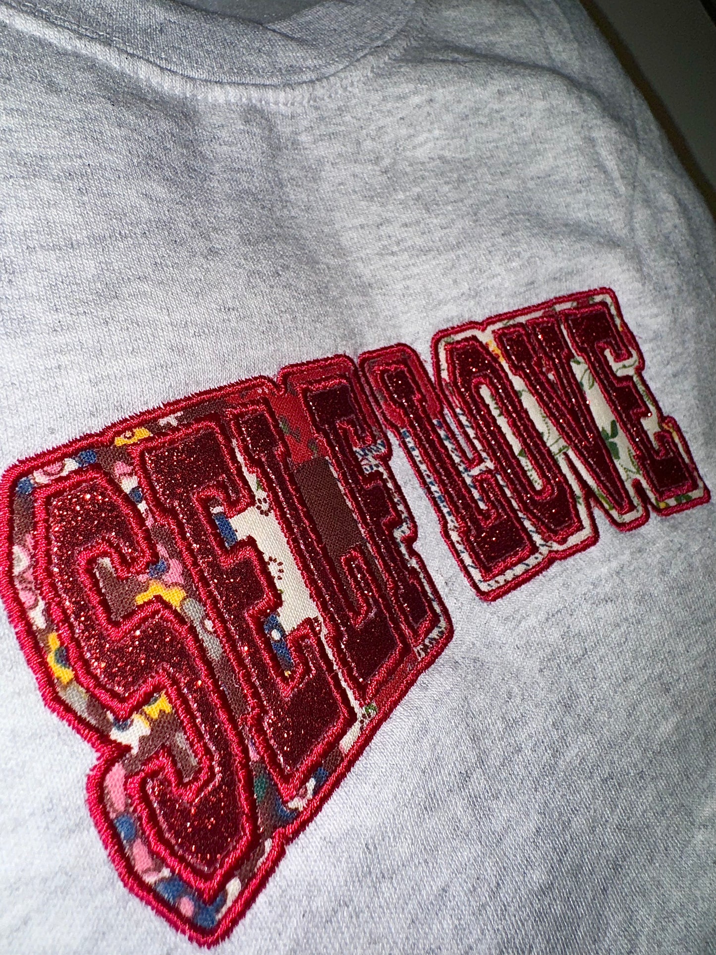 SELF LOVE glitter/fabric embroidered sweater