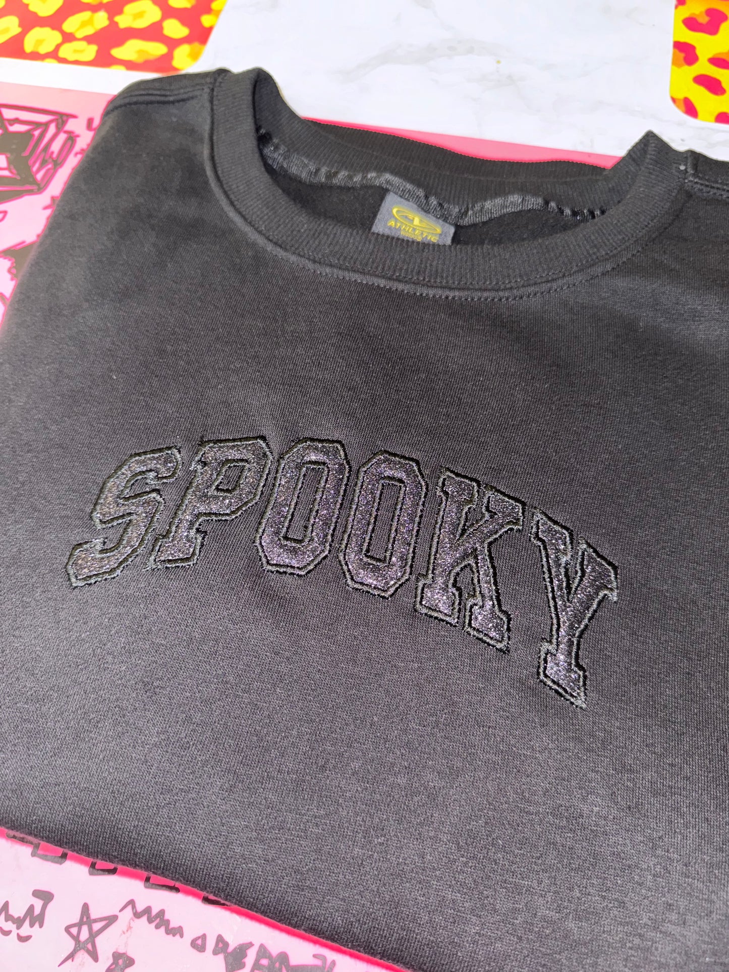 Embroidered black on black spooky top