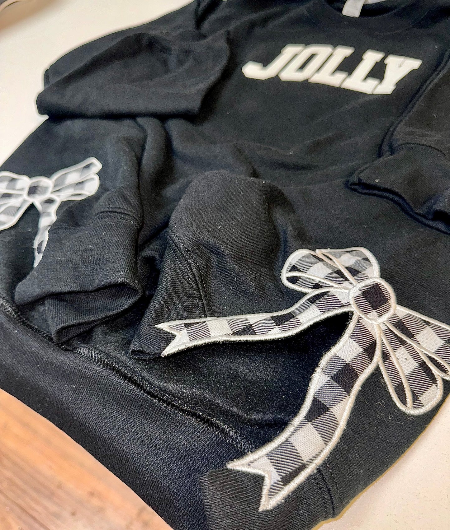 Embroidered glitter JOLLY w/ plaid side bows sweater top