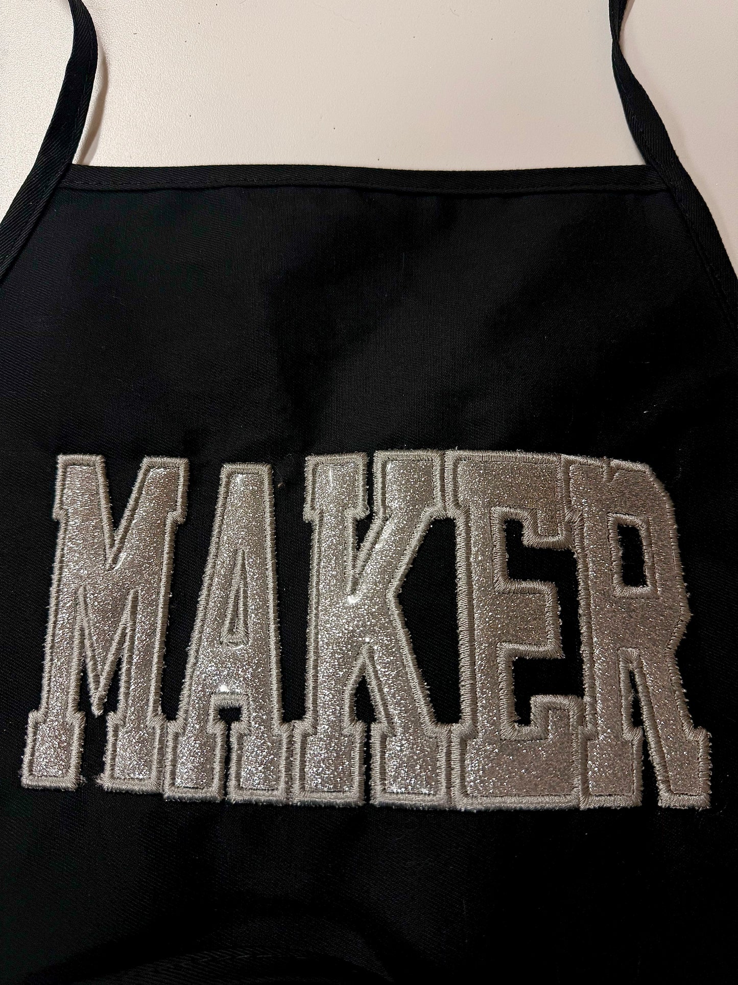 Glitter embroidered MAKER apron top