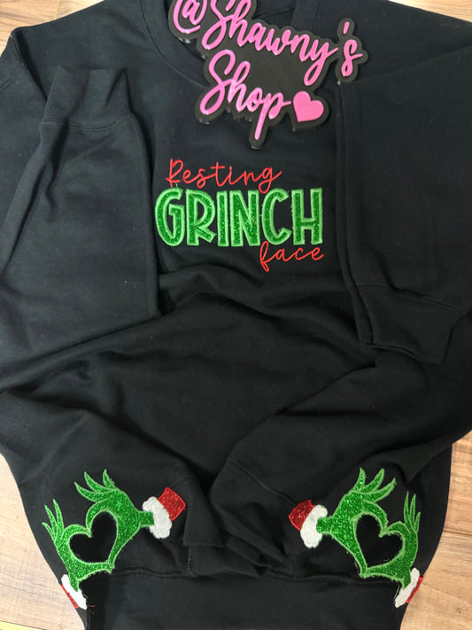 Embroidered resting grinch face w/ side hearts sweater