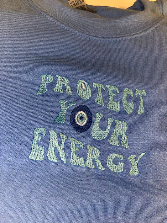 Protect your energy embroidered top