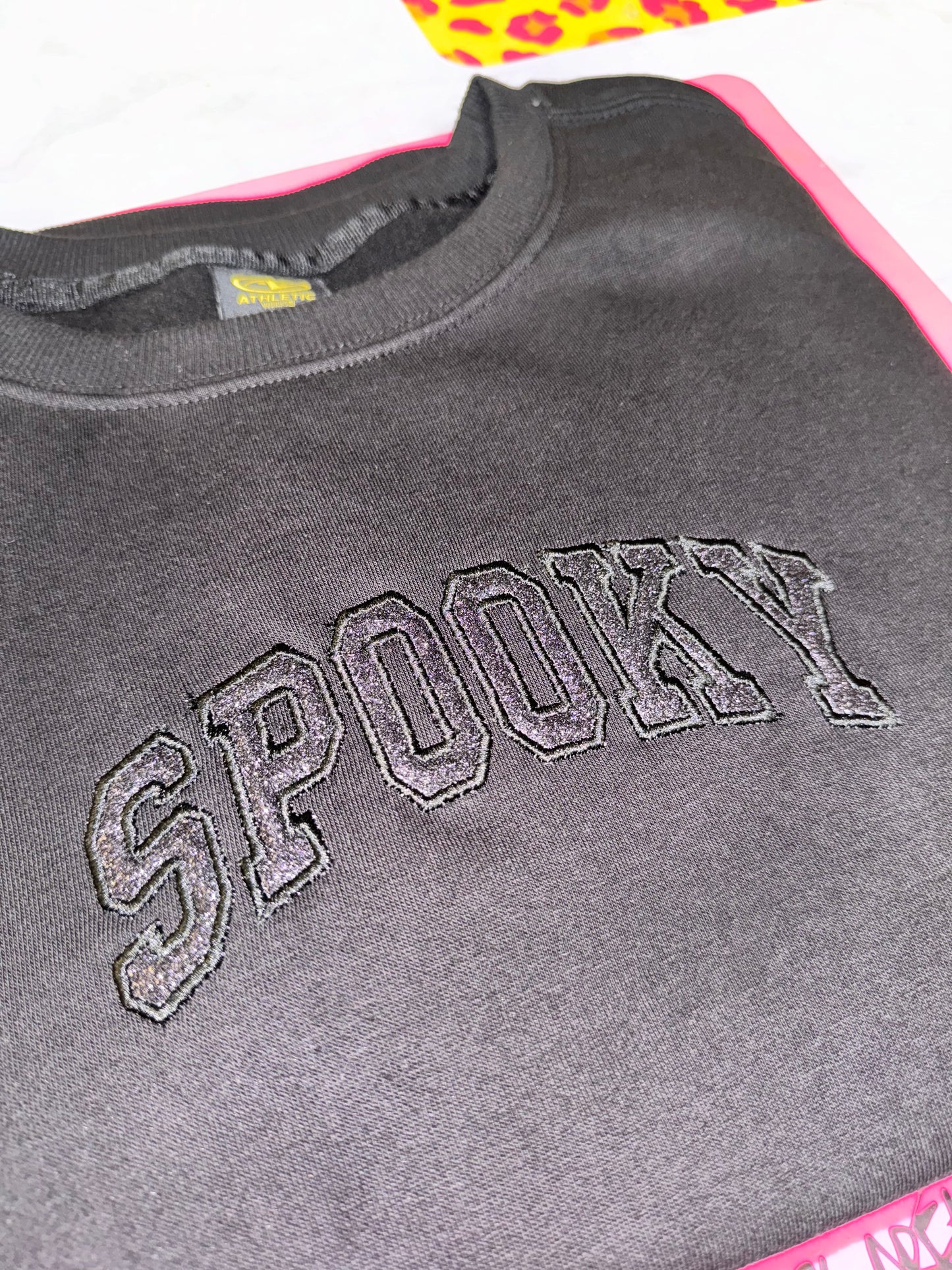Embroidered black on black spooky top
